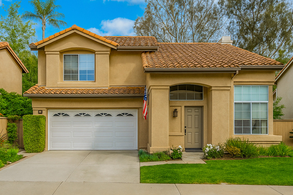 Two-story home for sale in Laguna Audubon, Aliso Viejo with attached garage and landscaped front yard
